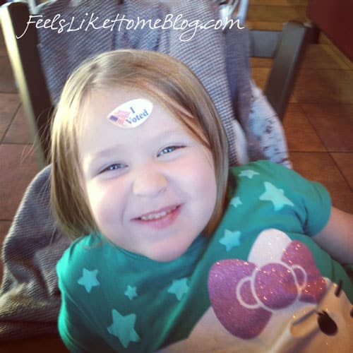 A little girl with a sticker on her forehead