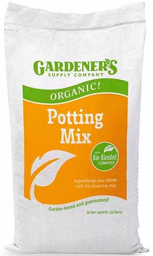 A close up of a bag of Gardener\'s Supply Company Organic Potting Mix isolated on a white background.