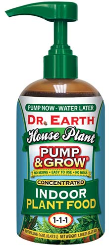 A close up of a bottle of Dr Earth Pump and Grow isolated on a white background.