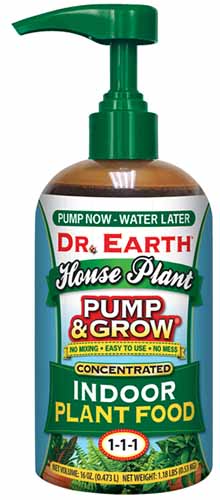 A close up of a bottle of Dr Earth Pump and Grow isolated on a white background.